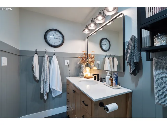 a view of a dining area with furniture and a clock
