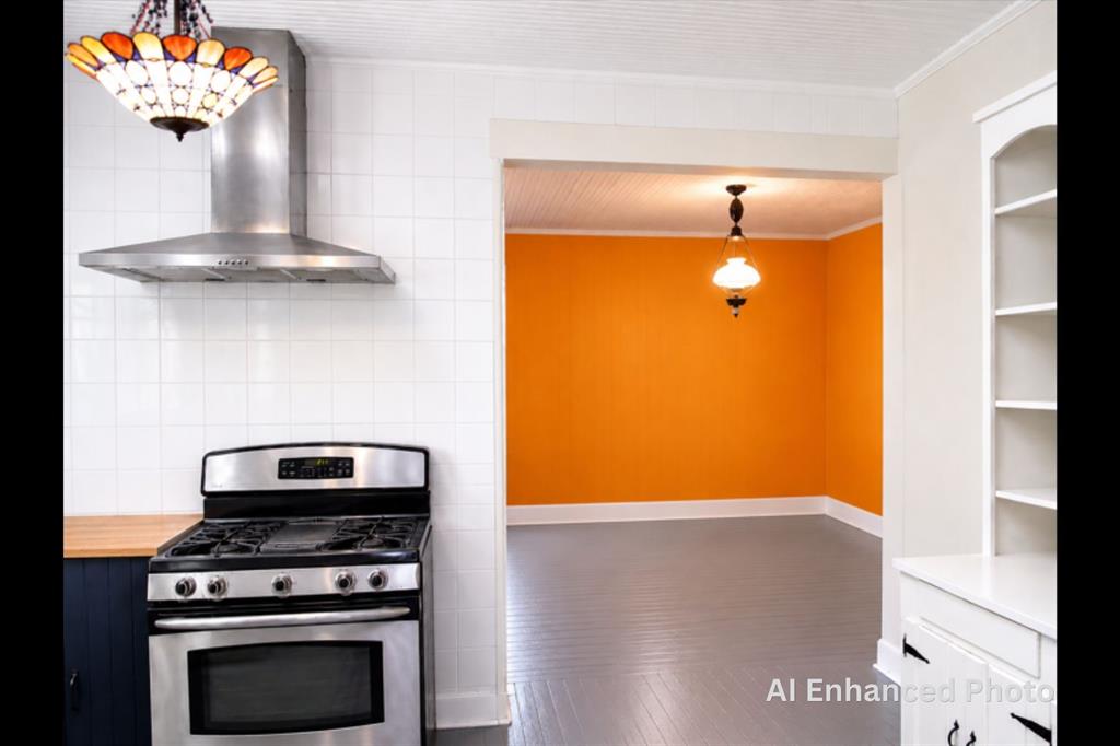 1500 Bonham Street Commerce, TX 75428 - Photo 20 of 29 a kitchen with a stove and a refrigerator