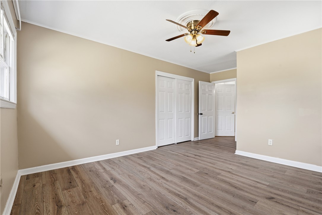 4304 Old Buncombe Road Greenville, SC 29617 - Photo 16 of 50 This spacious bedroom offers ample natural light and contemporary flooring, creating a welcoming retreat.