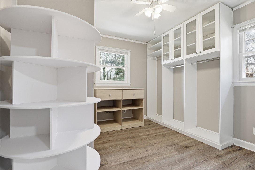 4304 Old Buncombe Road Greenville, SC 29617 - Photo 18 of 50 This spacious closet offers custom built-ins and ample storage, creating a functional and organized space.