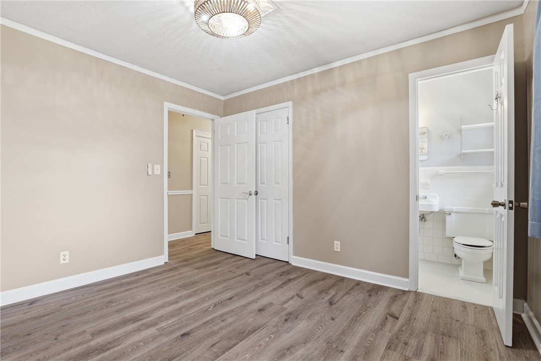 4304 Old Buncombe Road Greenville, SC 29617 - Photo 21 of 50 This versatile room features durable flooring and offers direct access to a private bathroom, ensuring convenience.
