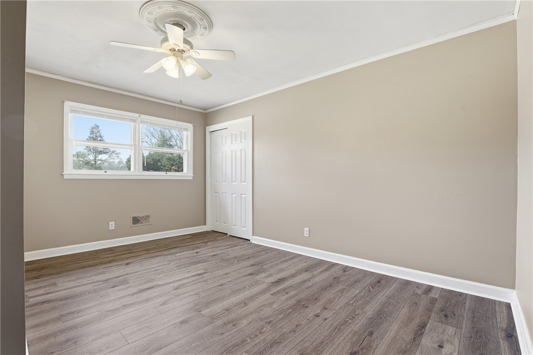 4304 Old Buncombe Road Greenville, SC 29617 - Photo 23 of 50 This spacious room features ample natural light and durable flooring, offering a comfortable living space.