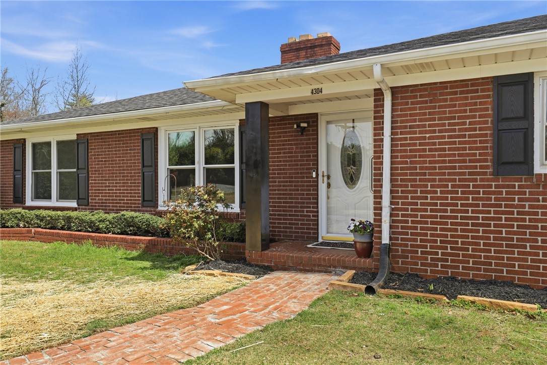 4304 Old Buncombe Road Greenville, SC 29617 - Photo 3 of 50 This classic brick residence features a welcoming entrance and well-maintained grounds.