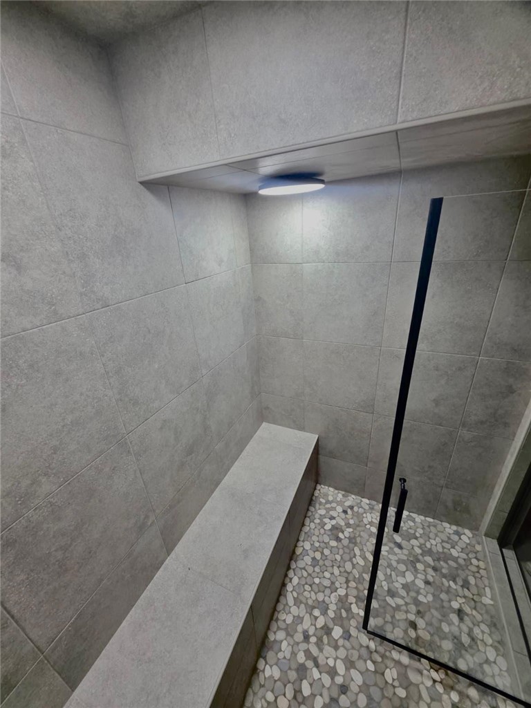 4304 Old Buncombe Road Greenville, SC 29617 - Photo 32 of 50 Steam shower tucked neatly under the basement stairs, offering a unique and spa-like retreat.