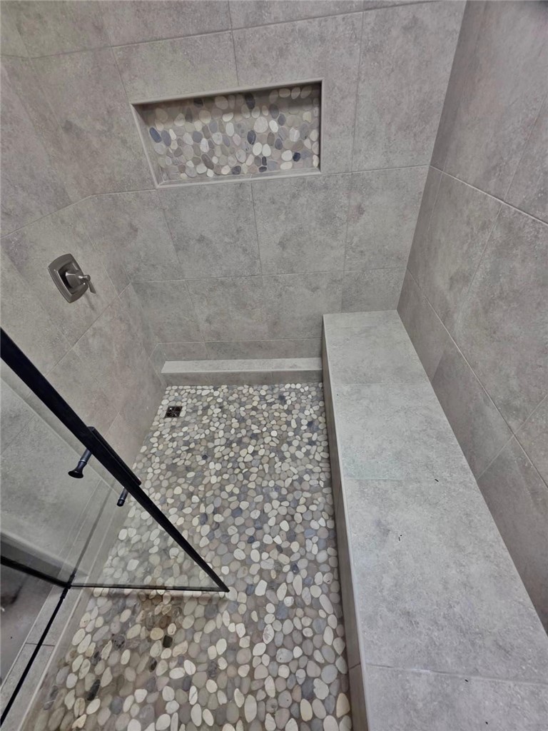 4304 Old Buncombe Road Greenville, SC 29617 - Photo 33 of 50 Cozy steam shower thoughtfully positioned beneath the basement staircase for a private, spa-inspired experience.