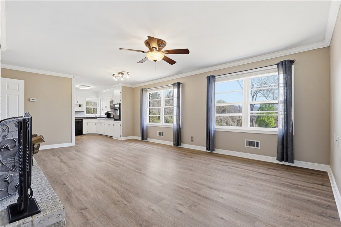 4304 Old Buncombe Road Greenville, SC 29617 - Photo 7 of 50 This bright living area features abundant natural light and an open-concept layout.