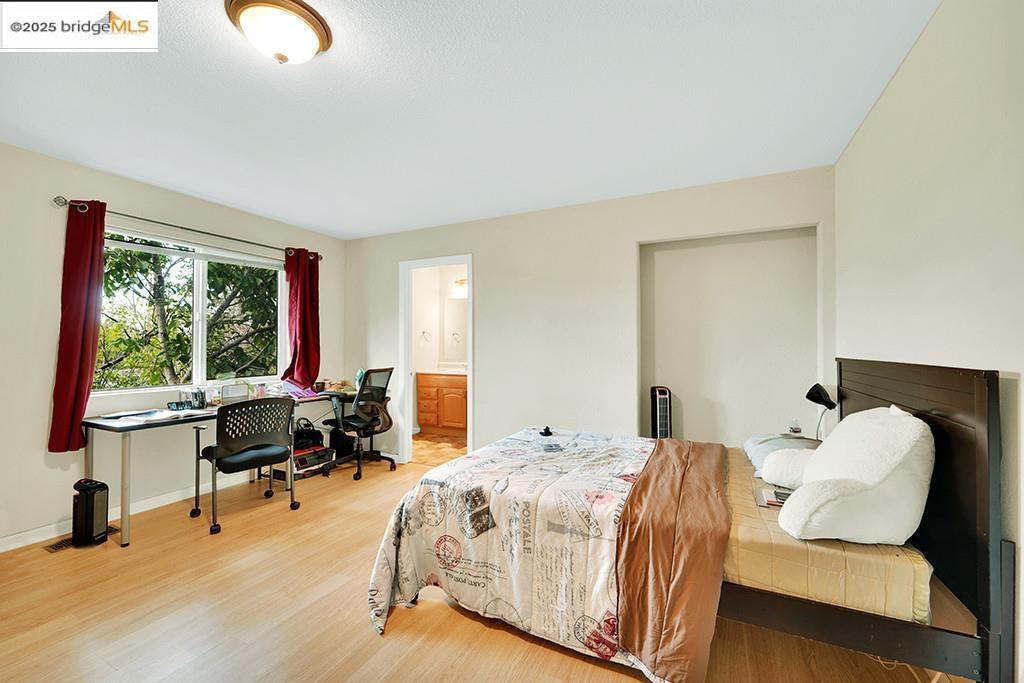 1259 Fulton Avenue Vallejo, CA 94591 - Photo 20 of 28 a bedroom with bed and a large window