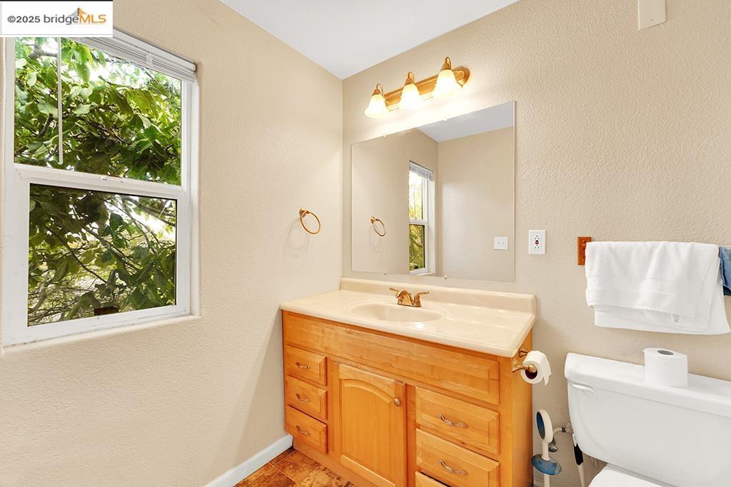 1259 Fulton Avenue Vallejo, CA 94591 - Photo 27 of 28 a bathroom with a sink mirror vanity and a bathtub