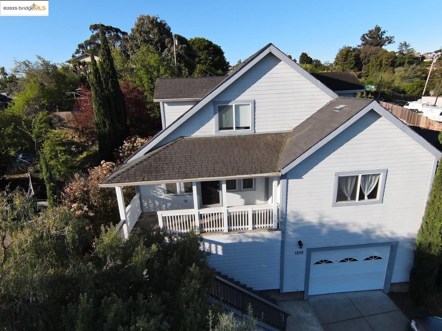 1259 Fulton Avenue Vallejo, CA 94591 - Photo 5 of 28 a white house with tall trees in the background