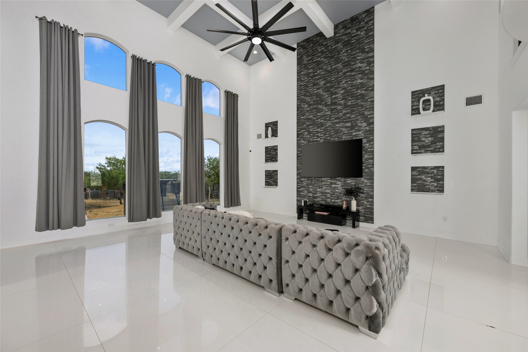 507 Rawhide Road Seguin, TX 78155 - Photo 11 of 40 Living room featuring light tile patterned floors and a ceiling fan