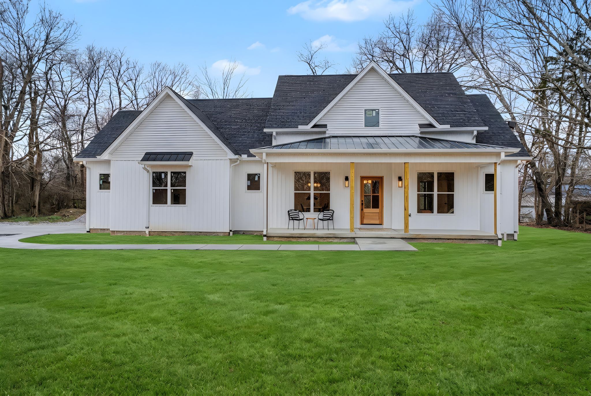 a view of a house with a backyard