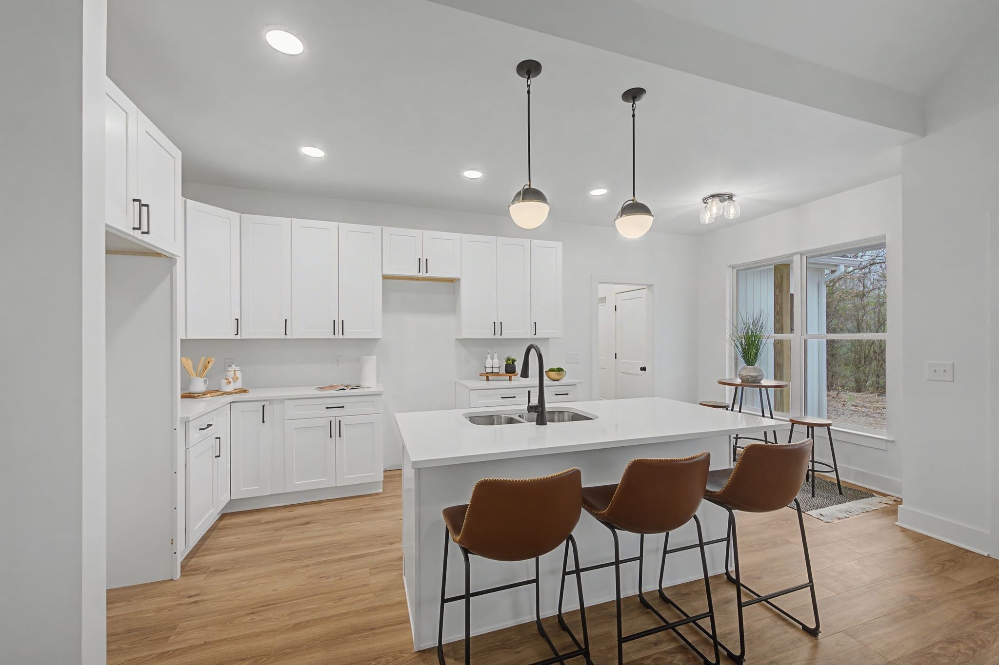 1171 Old Charlotte Road White Bluff, TN 37187 - Photo 12 of 29 a kitchen with kitchen island granite countertop a sink cabinets and wooden floor