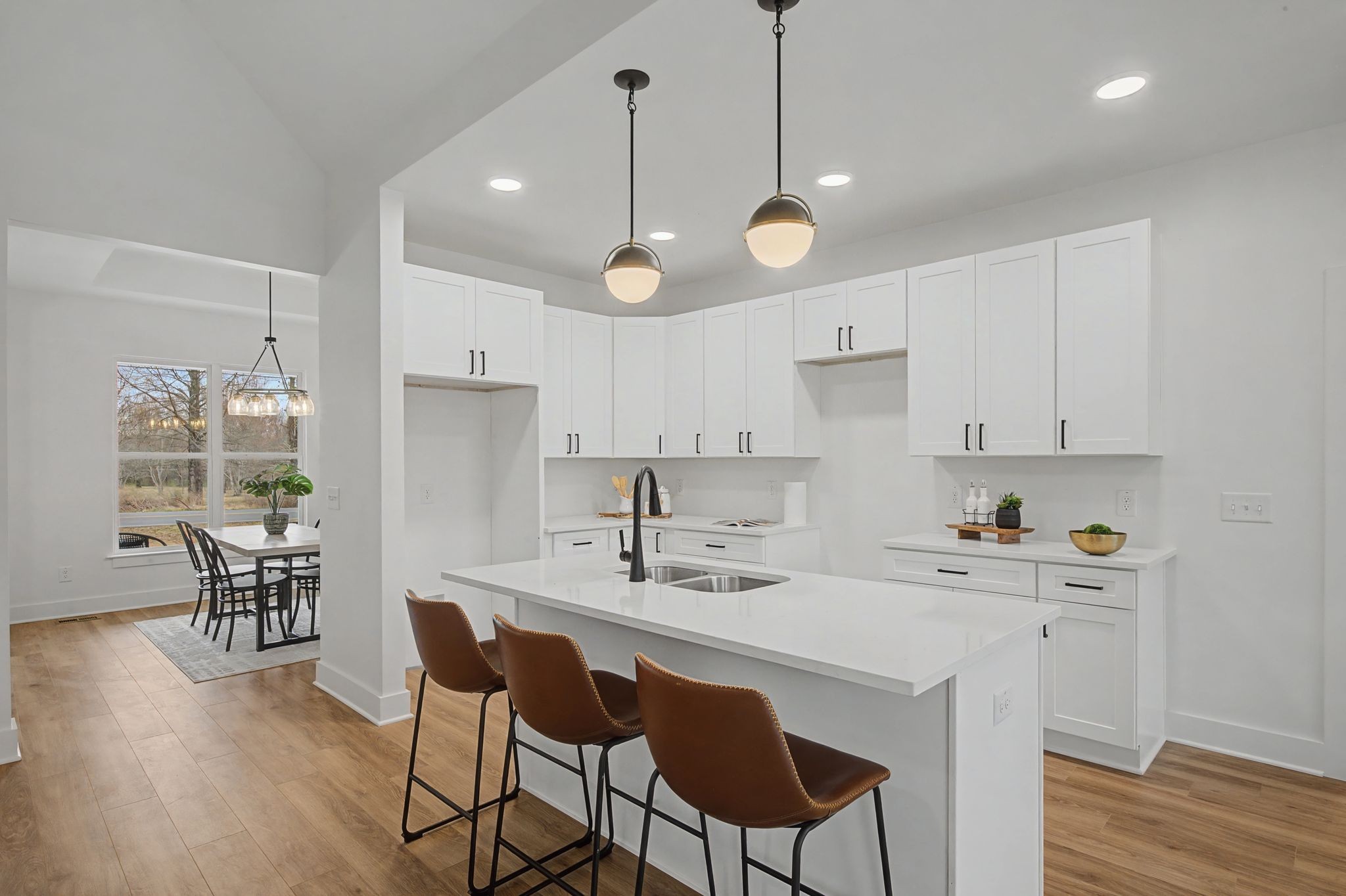1171 Old Charlotte Road White Bluff, TN 37187 - Photo 13 of 29 a kitchen with a dining table chairs and wooden floor