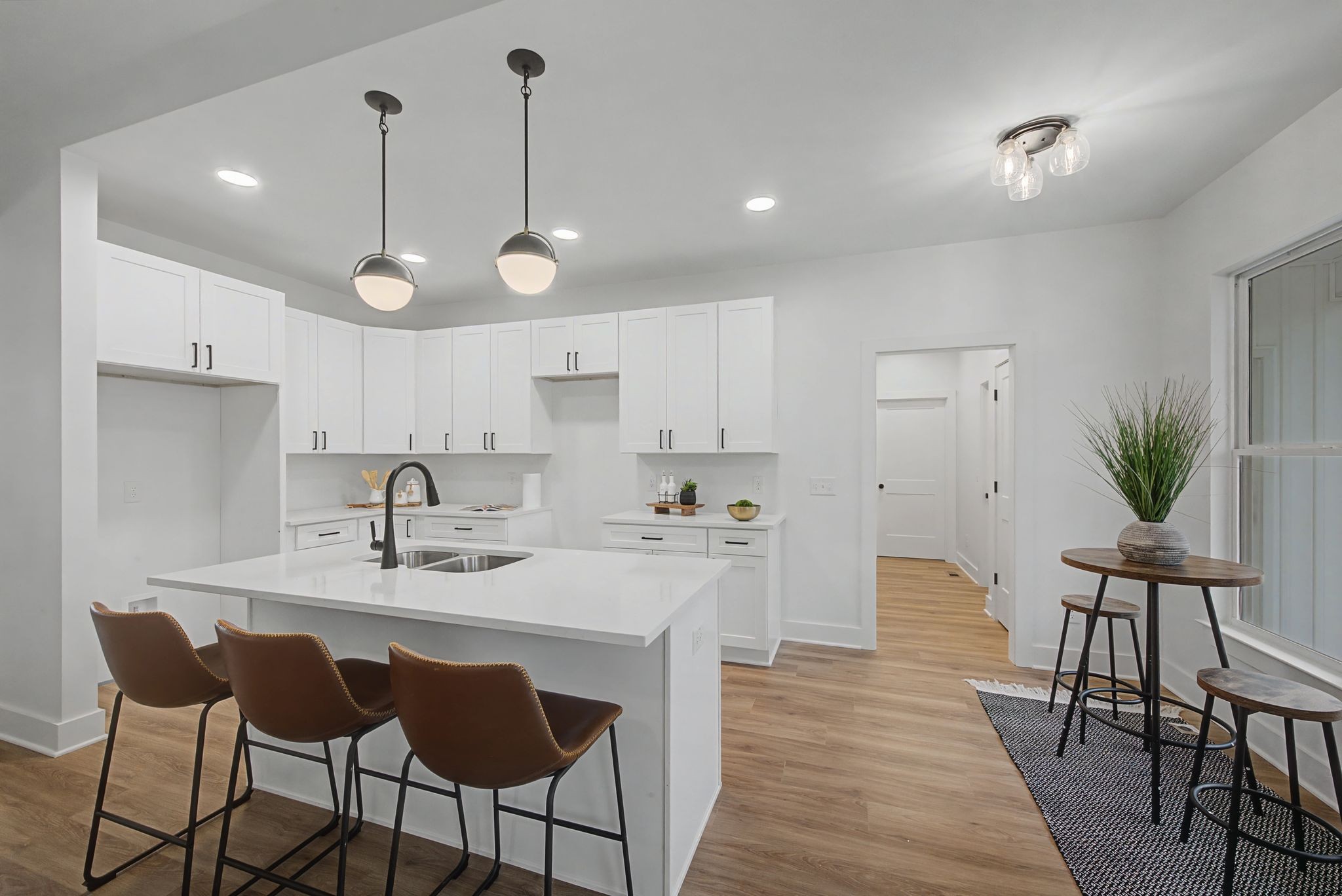 1171 Old Charlotte Road White Bluff, TN 37187 - Photo 14 of 29 a kitchen with stainless steel appliances kitchen island granite countertop a dining table chairs and white cabinets