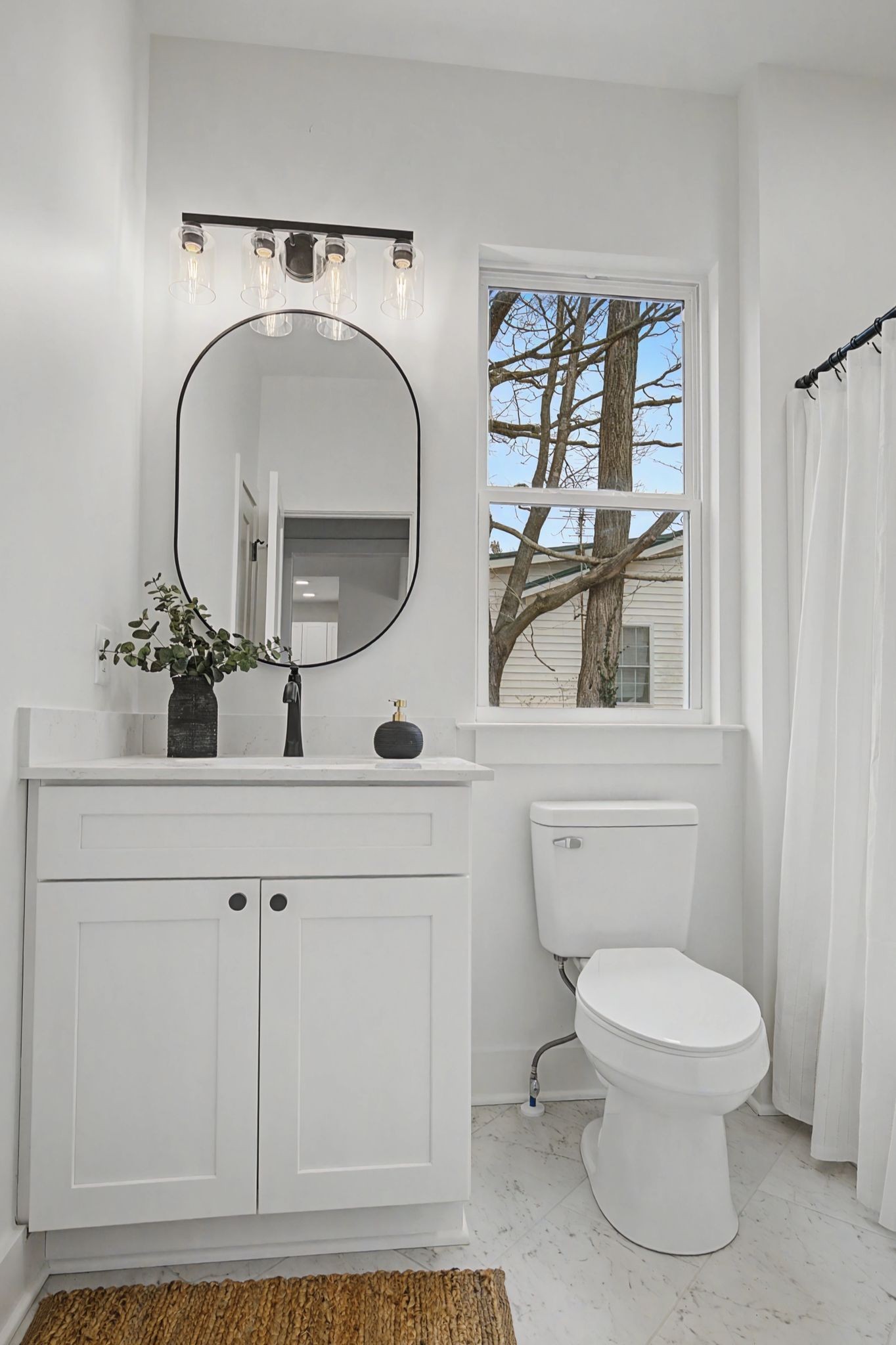 1171 Old Charlotte Road White Bluff, TN 37187 - Photo 25 of 29 a bathroom with a toilet a sink and mirror