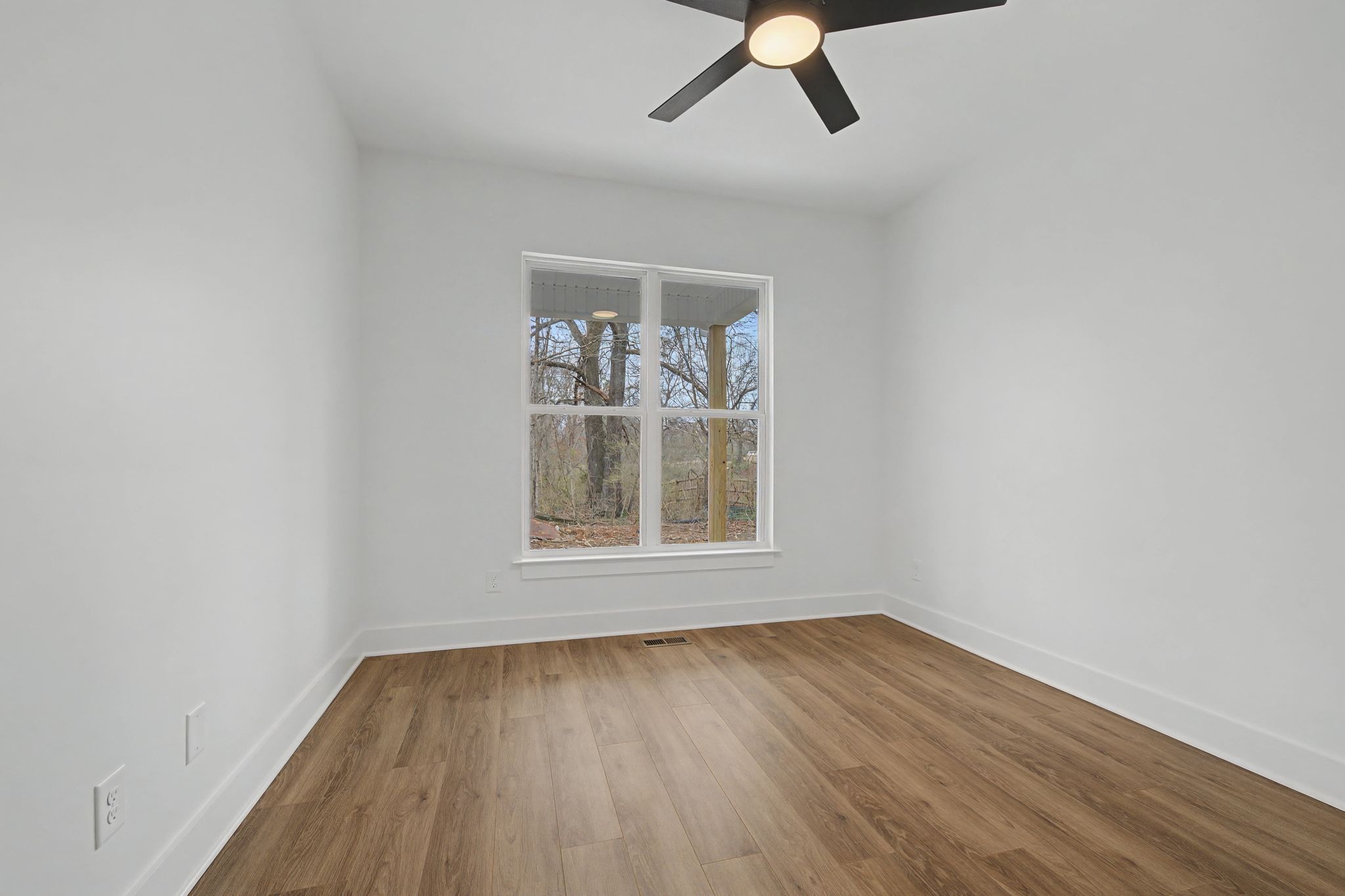 1171 Old Charlotte Road White Bluff, TN 37187 - Photo 26 of 29 an empty room with a window