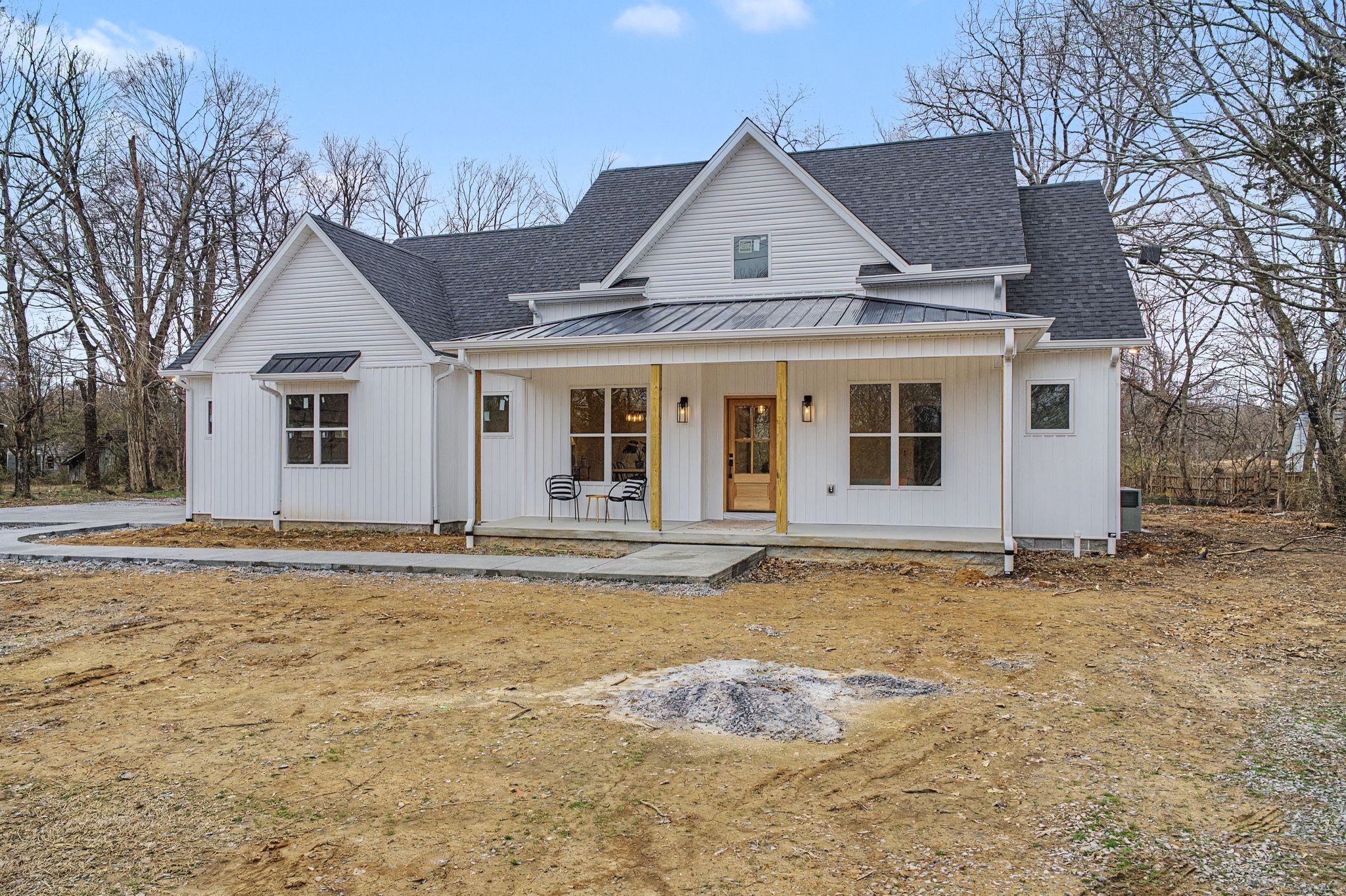 1171 Old Charlotte Road White Bluff, TN 37187 - Photo 3 of 29 a front view of a house with a yard