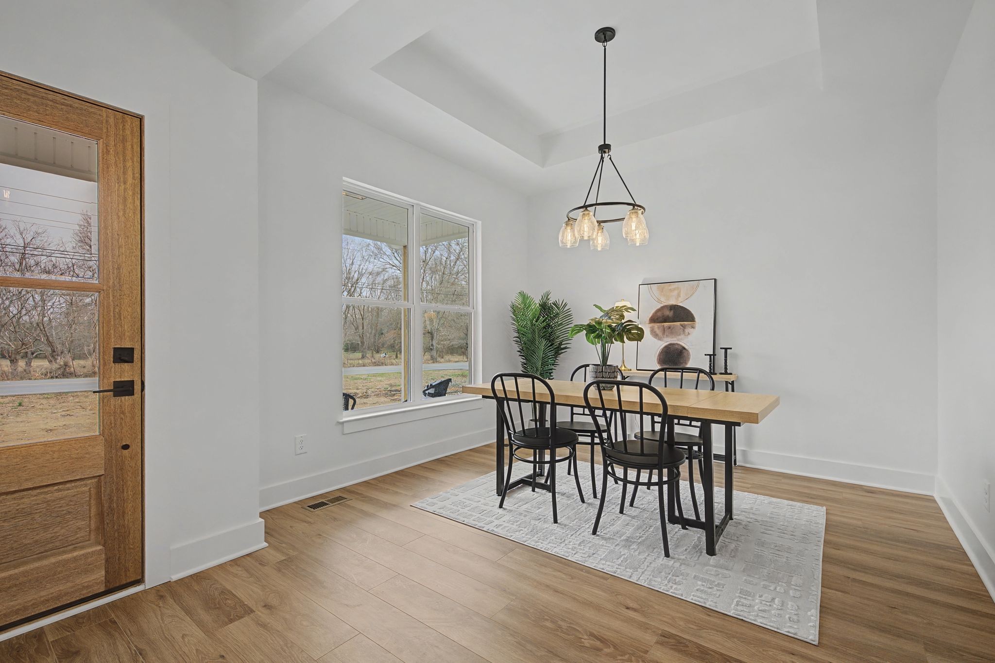1171 Old Charlotte Road White Bluff, TN 37187 - Photo 7 of 29 a view of a dining room with furniture window and wooden floor