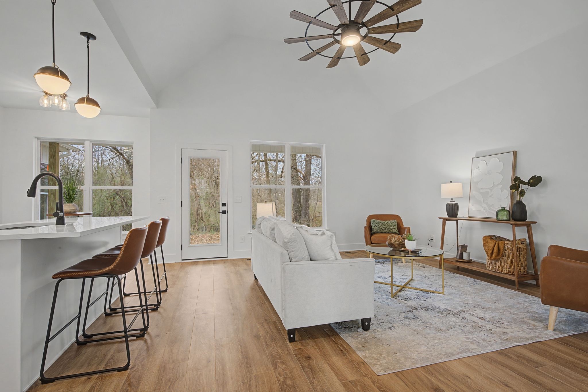 1171 Old Charlotte Road White Bluff, TN 37187 - Photo 9 of 29 a living room with furniture a dining table and a fireplace