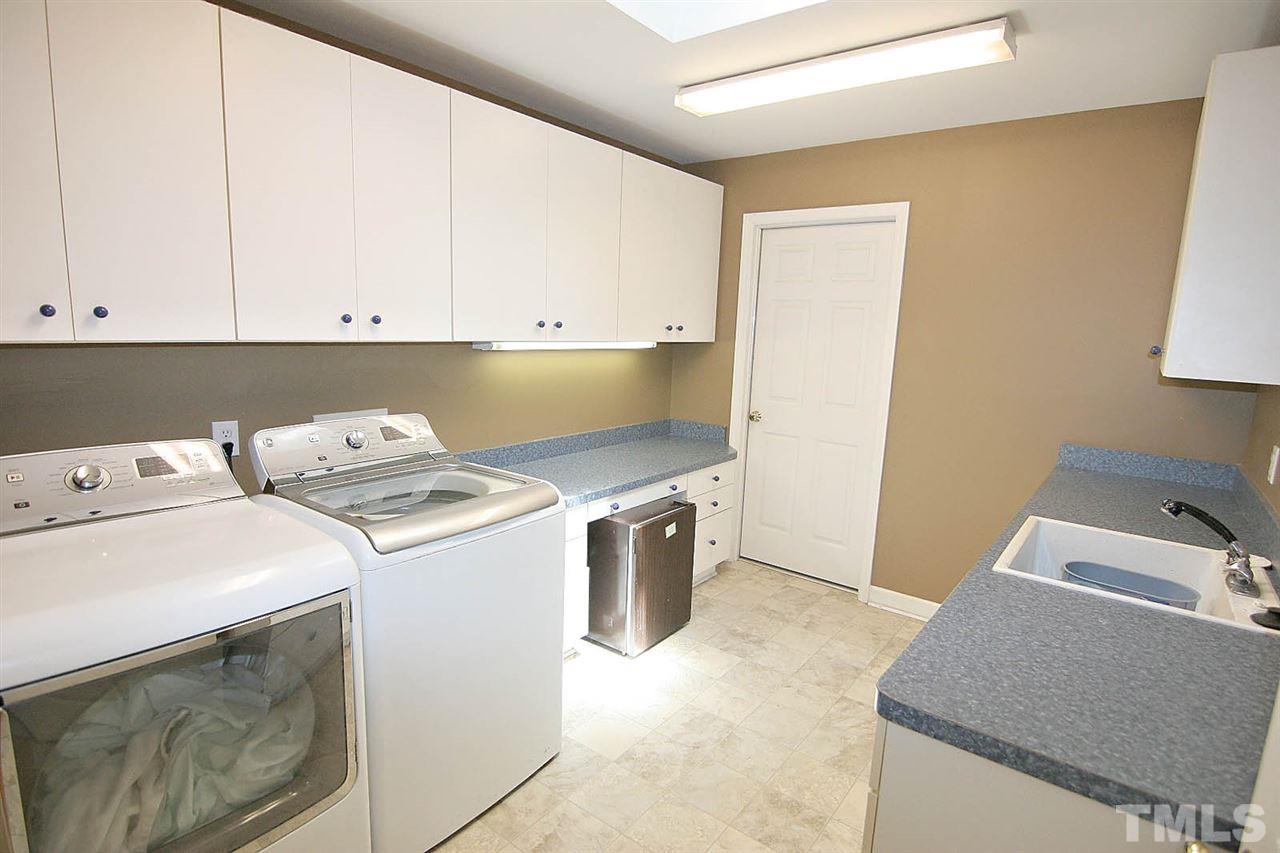 218 Queensferry Road Cary, NC 27511 - Photo 21 of 25 a utility room with dryer and washer