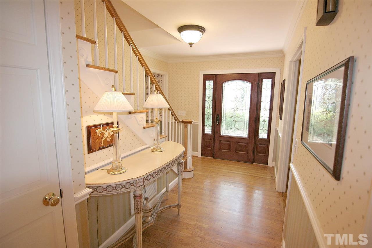 218 Queensferry Road Cary, NC 27511 - Photo 6 of 25 a view of an entryway with wooden floor