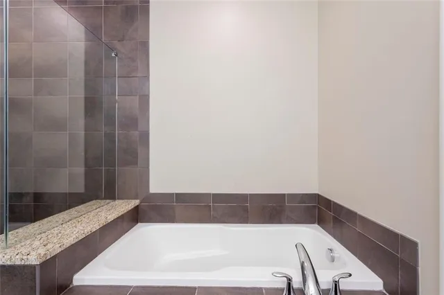 a bathroom with a shower and a toilet