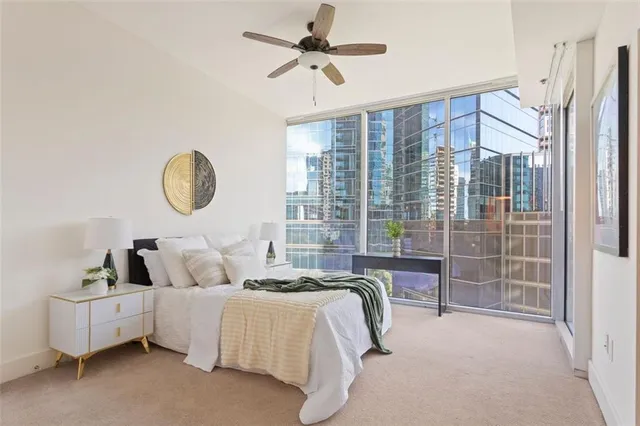 a bedroom with bed and a chandelier