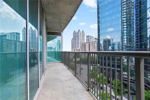 a view of a balcony with an outdoor space