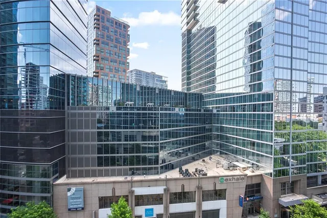 a view of a swimming pool with outdoor seating