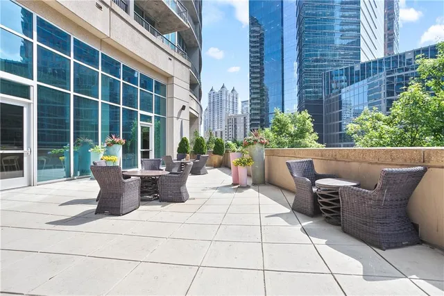 a view of balcony with furniture