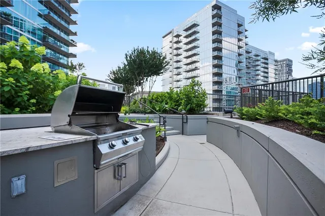 a view of a chairs and table in a backyard