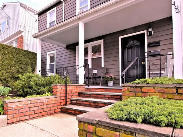 front view of a house with a small yard