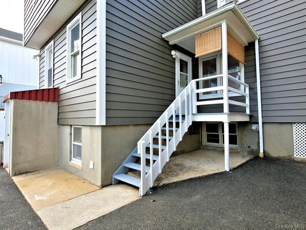 a view of house with deck and balcony
