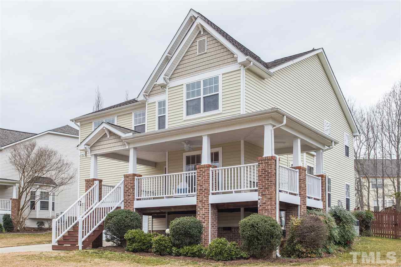 107 Locke Woods Road Raleigh, NC 27603 - Photo 1 of 30 a view of a white building among the street with palm trees