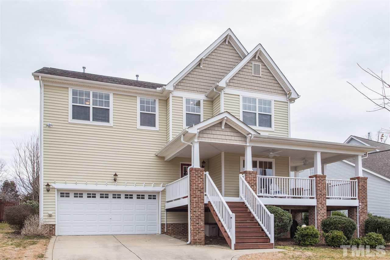 107 Locke Woods Road Raleigh, NC 27603 - Photo 2 of 30 a front view of a house with a porch