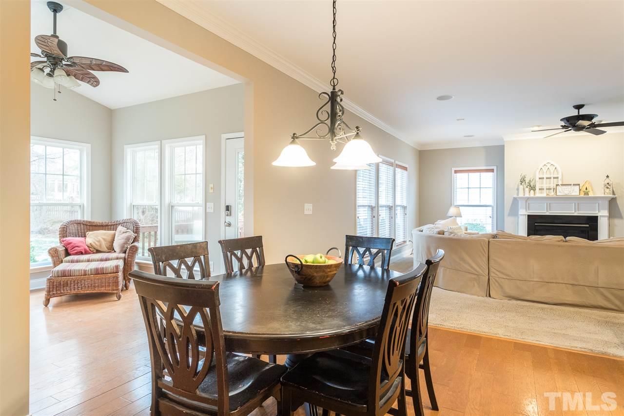 107 Locke Woods Road Raleigh, NC 27603 - Photo 11 of 30 a view of a a dining room with furniture window and wooden floor