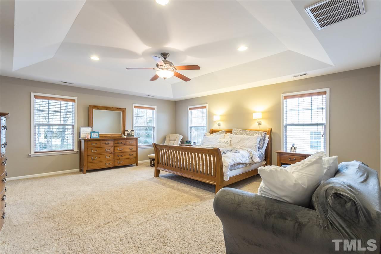 107 Locke Woods Road Raleigh, NC 27603 - Photo 16 of 30 a bedroom with furniture and a window