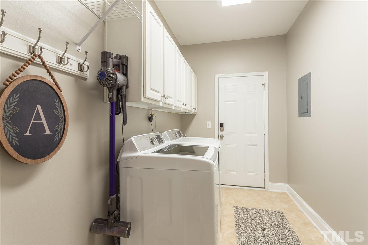 107 Locke Woods Road Raleigh, NC 27603 - Photo 27 of 30 a utility room with dryer and washer