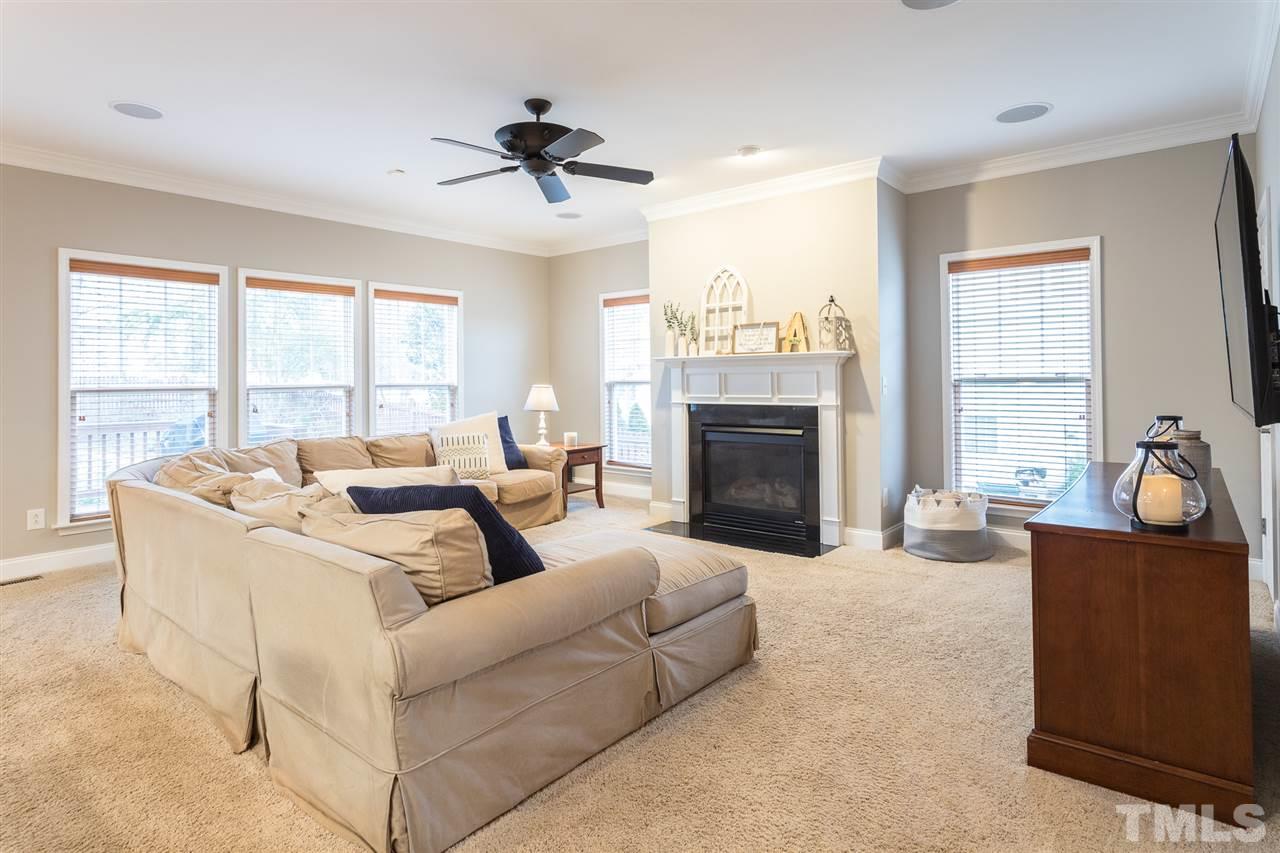 107 Locke Woods Road Raleigh, NC 27603 - Photo 4 of 30 a living room with furniture and a fireplace