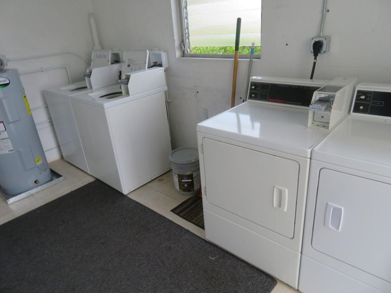 101 Akron Street, Unit 101 Lake Worth Beach, FL 33461 - Photo 11 of 11 a utility room with dryer and washer