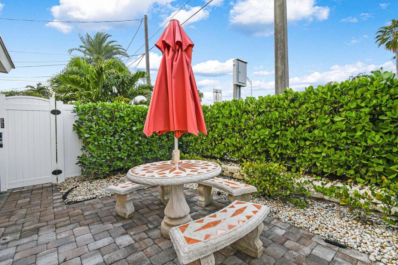 101 Akron Street, Unit 101 Lake Worth Beach, FL 33461 - Photo 9 of 11 a outdoor view with a chair and table