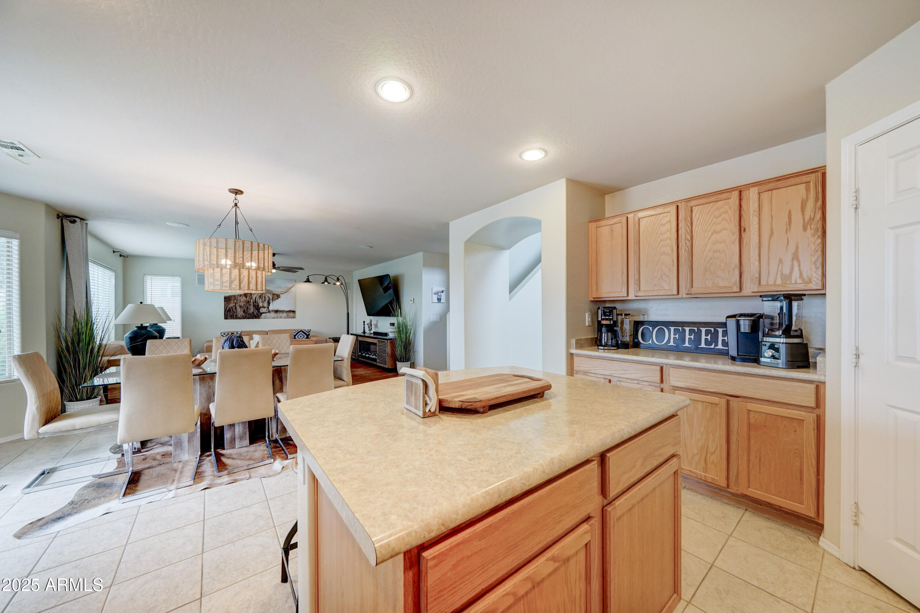 Undisclosed Address San Tan Valley, AZ 85143 - Photo 15 of 57 a kitchen with a table chairs sink and cabinets