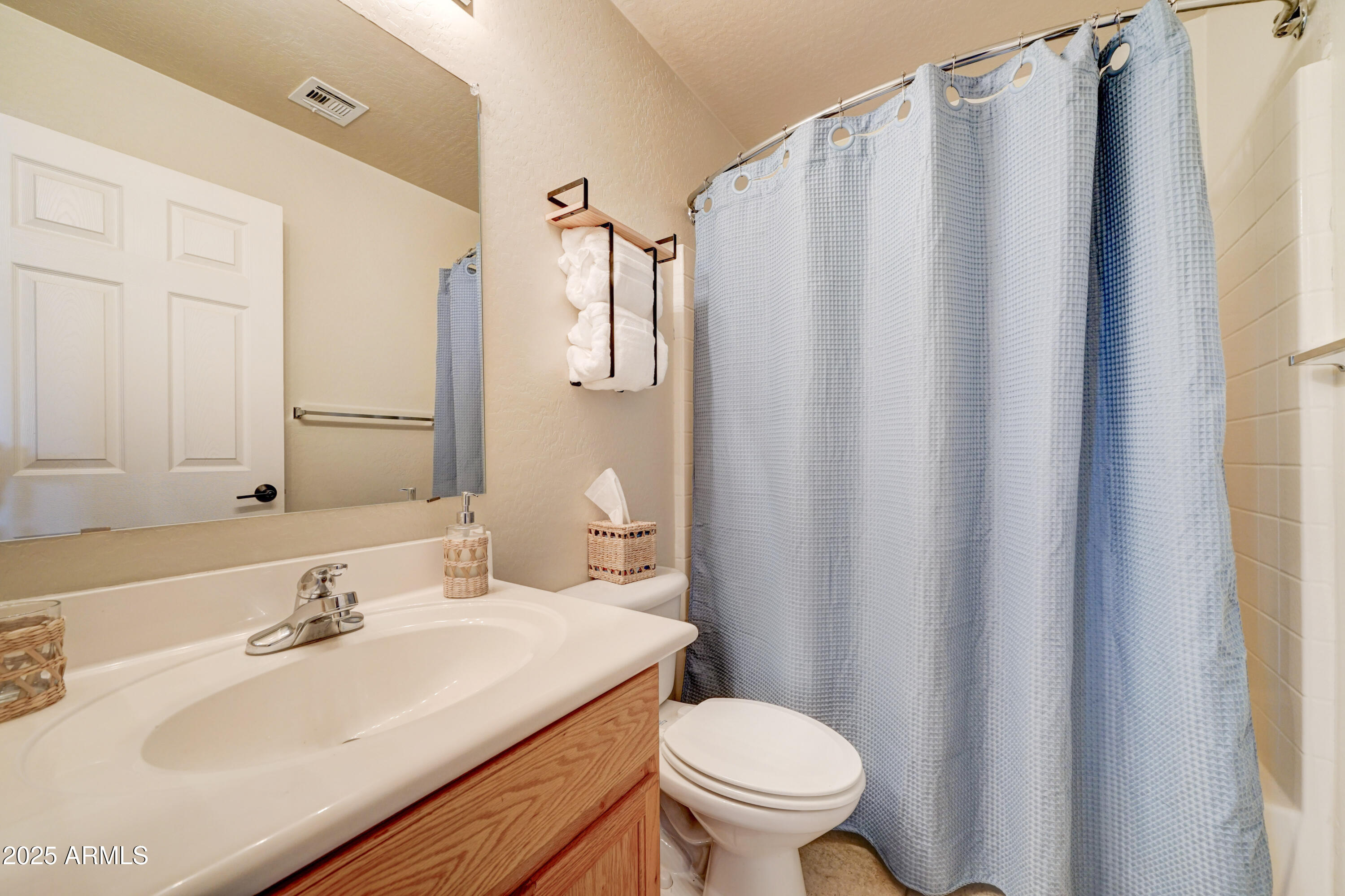Undisclosed Address San Tan Valley, AZ 85143 - Photo 20 of 57 a bathroom with a sink and a mirror