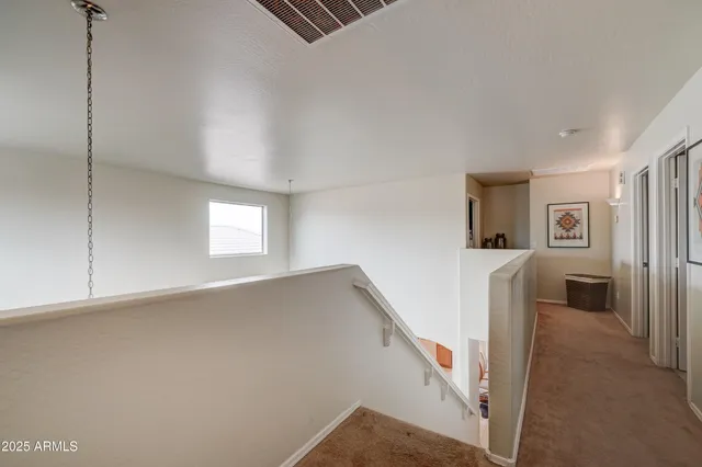 a bedroom with a bed couch and window