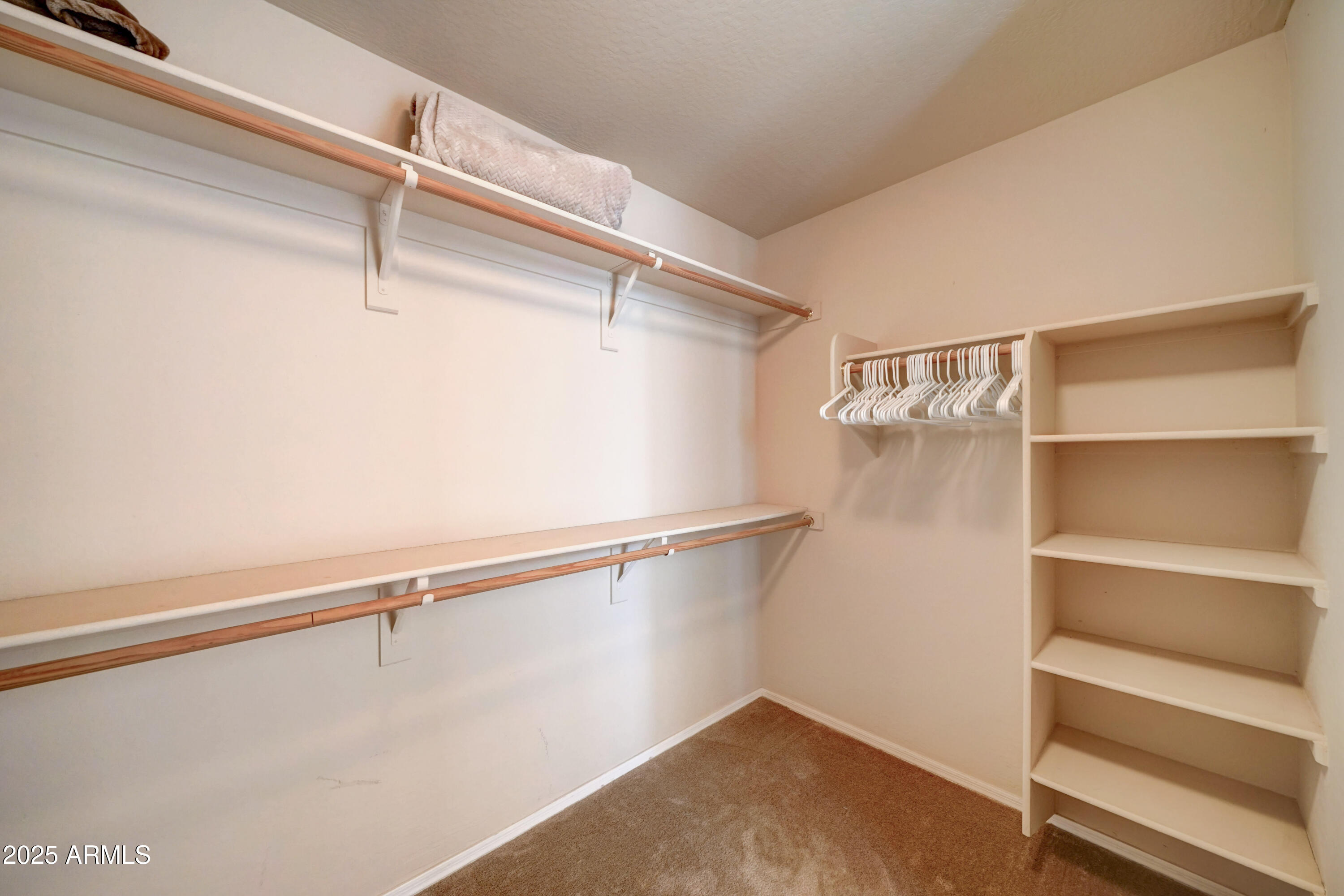 Undisclosed Address San Tan Valley, AZ 85143 - Photo 29 of 57 a view of a room with racks on the wall