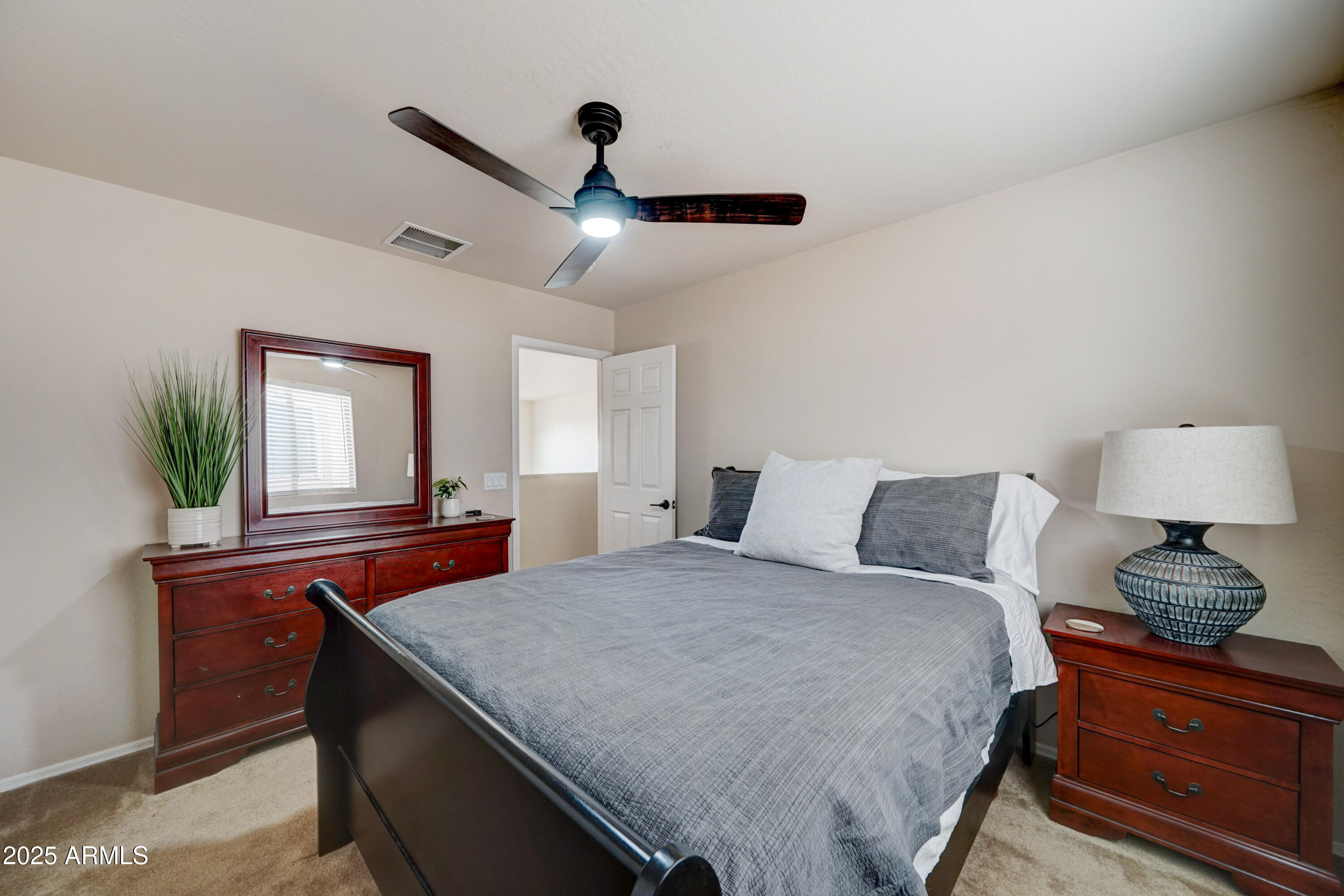 Undisclosed Address San Tan Valley, AZ 85143 - Photo 33 of 57 a bedroom with a bed and a dresser