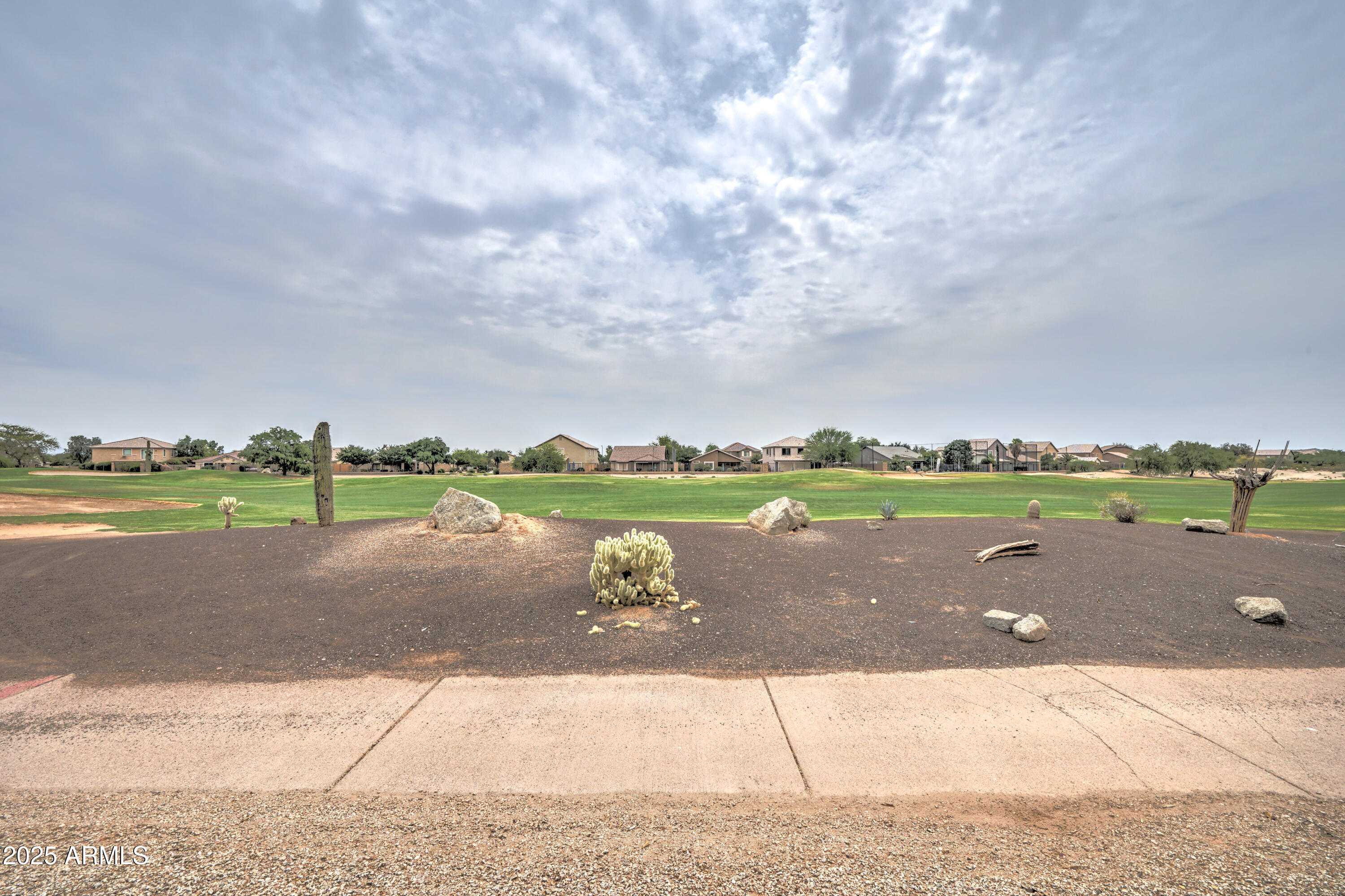 Undisclosed Address San Tan Valley, AZ 85143 - Photo 46 of 57 a view of a street with houses in the background