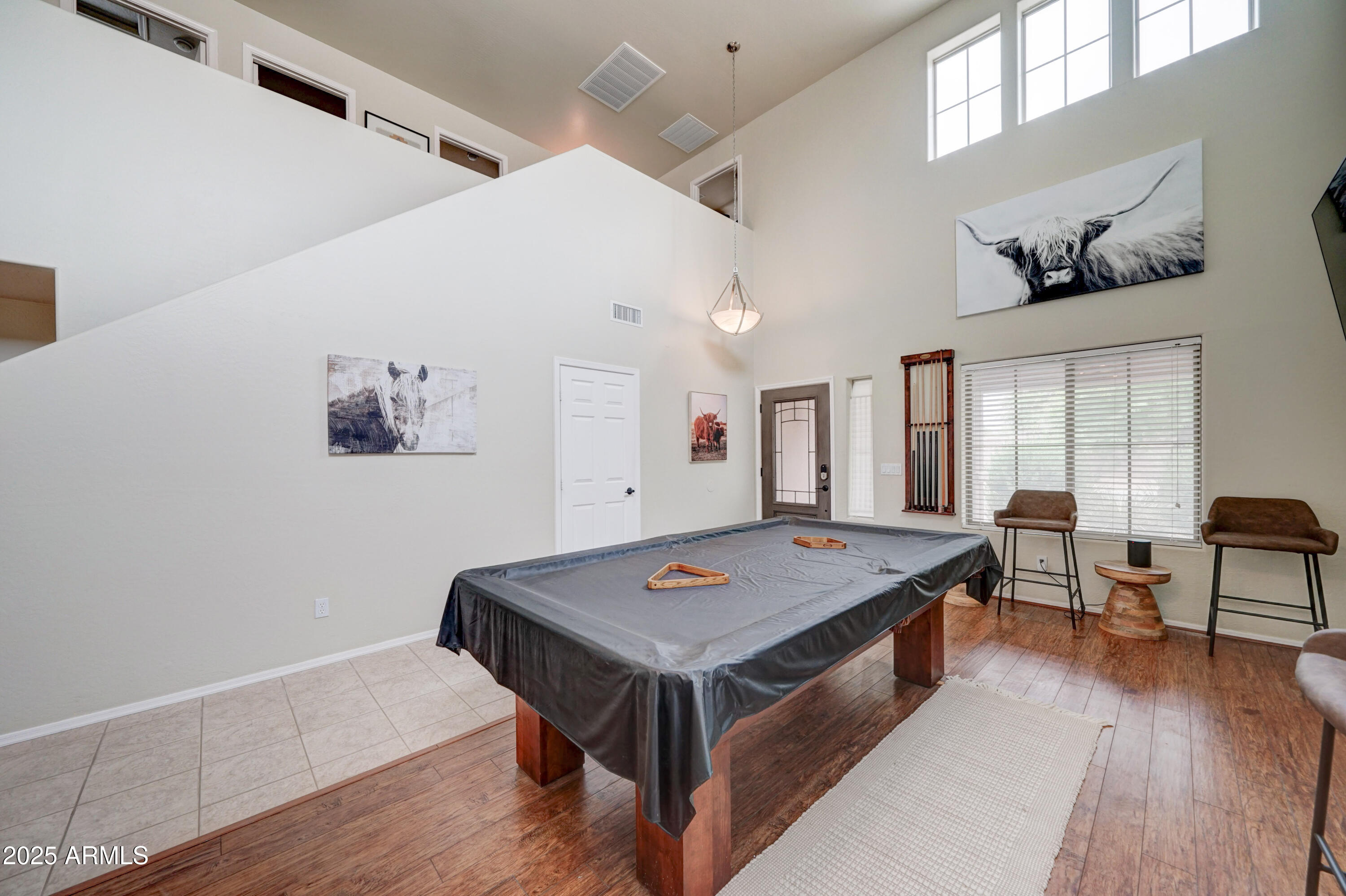 Undisclosed Address San Tan Valley, AZ 85143 - Photo 8 of 57 a living room with dining table and wooden floor