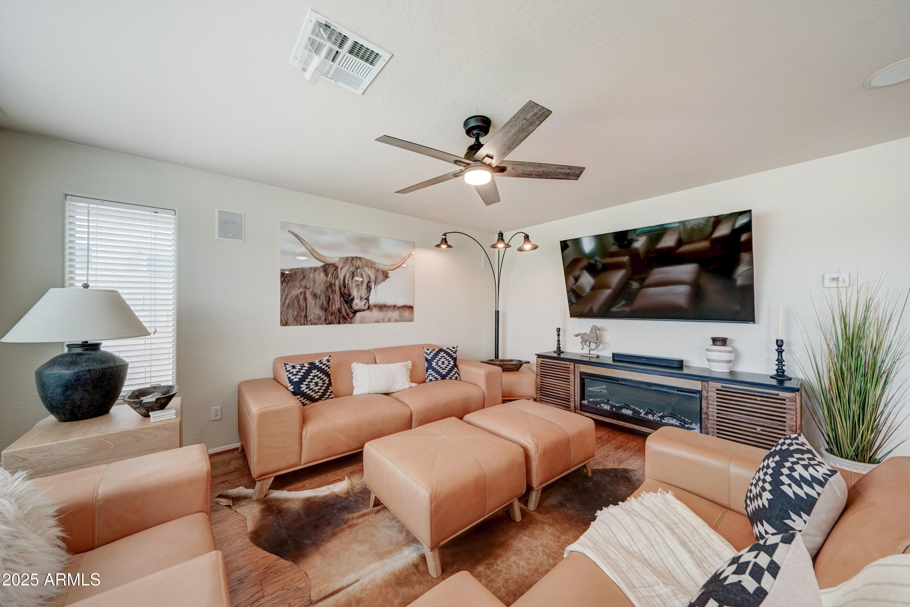 Undisclosed Address San Tan Valley, AZ 85143 - Photo 9 of 57 a living room with furniture and a flat screen tv