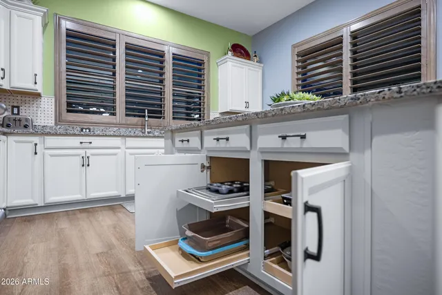 a kitchen with stainless steel appliances a stove and cabinets